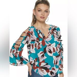 Jennifer Lopez Turquoise and Red Floral Blouse